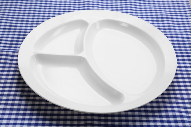 Empty serving tray for food on tablecloth