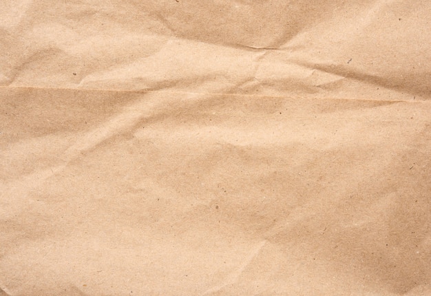 Photo empty sheet of brown wrapping kraft paper, vintage texture for the designer