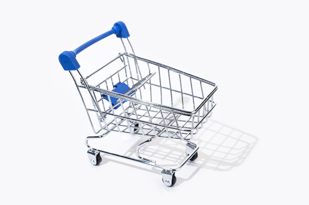 Empty shopping cart isolated on white