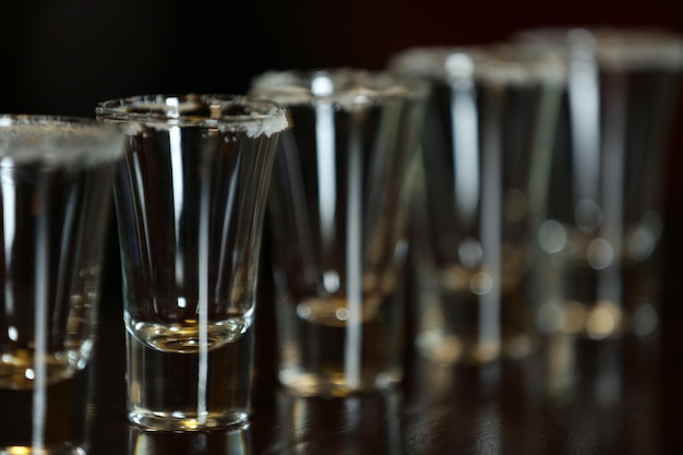 Empty shot glasses on bar counter