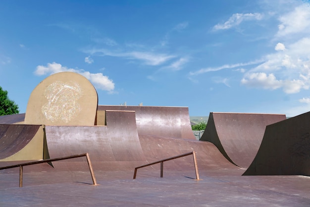 An  empty skatepark in the city public park. freestyle extreme sports spot