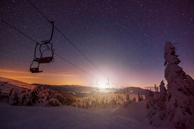 Empty ski resort with funiculars located on winter hills