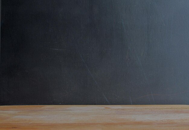 Empty slate board on a wooden base Copy space