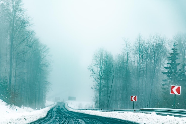 Empty snowed road in mountains