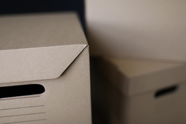 Empty solid cardboard boxes with covers beige containers to storage things