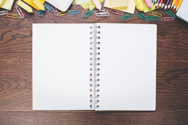 Empty spiral notepad on wooden desk top