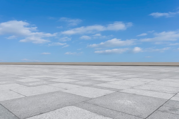 Empty square floor tiles and beautiful sky landscape