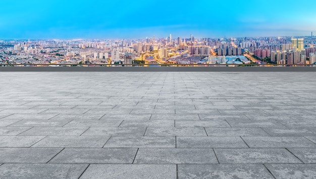 Empty square ground and city buildings background