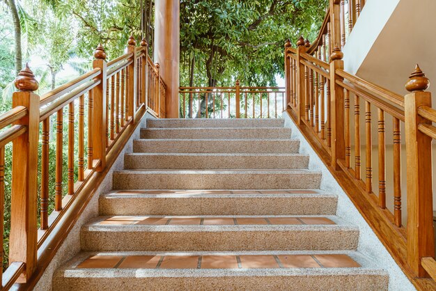 empty stair step with wood banister