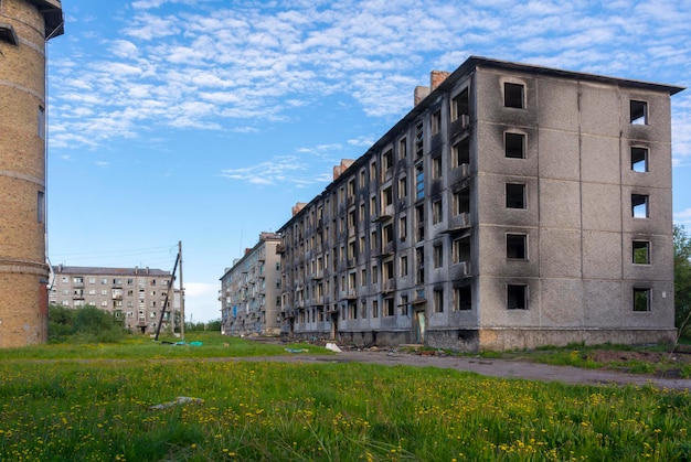 Empty streets of the abandoned settlement of Severny in the north. Burnt down apartment building. Vorkuta, Russia.