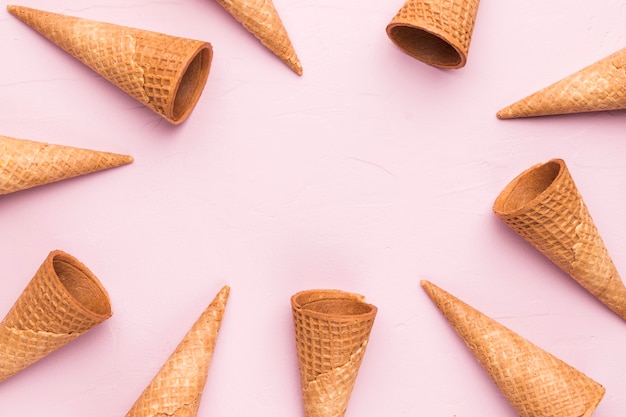 Empty summer waffle ice cream cones on pink background