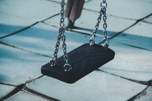 Empty swing hanging at playground