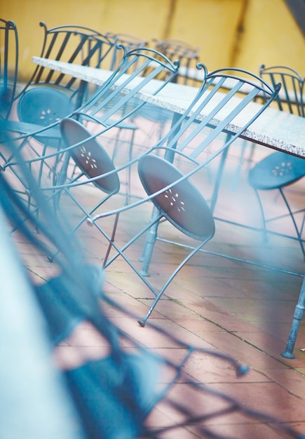 An empty table and chairs in a small cafe