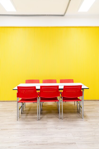 empty table and red chair in room