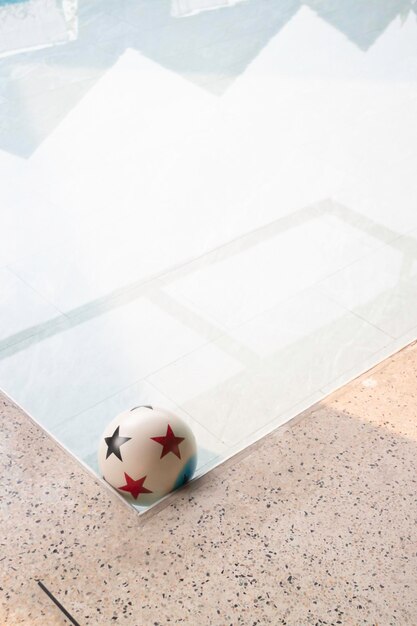 Empty table top and blurred swimming pool in tropical resort stock photo