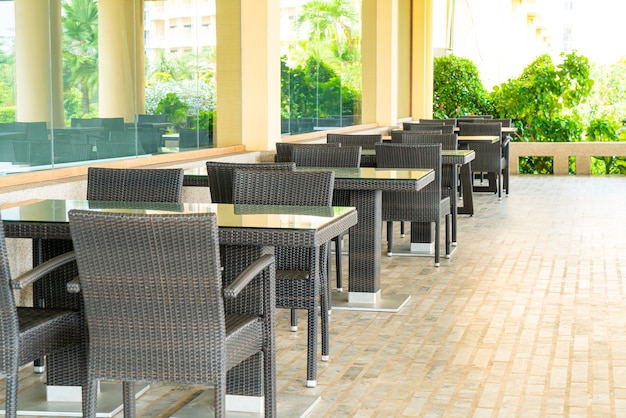 Empty tables and chairs in a terrace