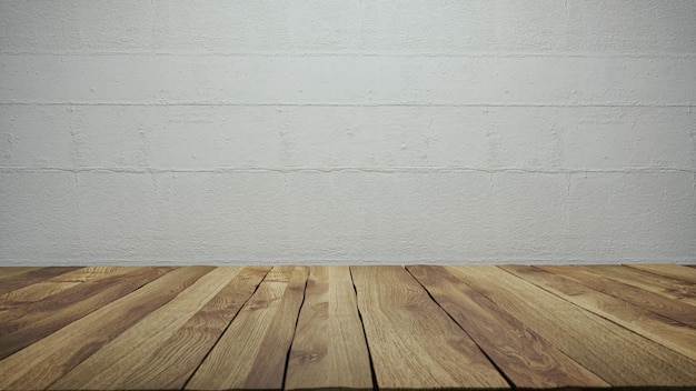 Empty tabletop over defocused white wall with copy space