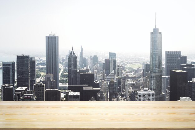 Empty tabletop made of wooden dies with Chicago city view at daytime on background template