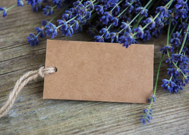 Empty tag and lavender flowers