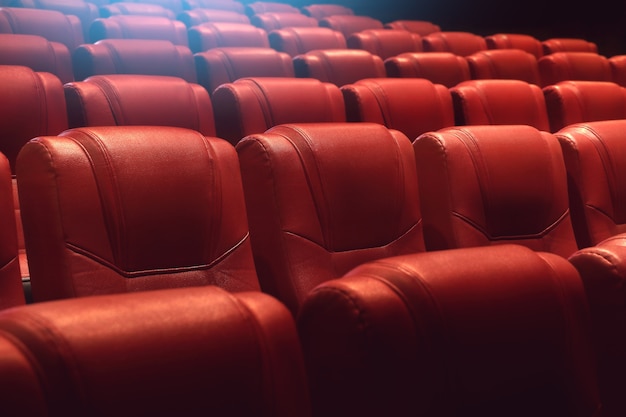 empty theater auditorium or movie cinema with red seats