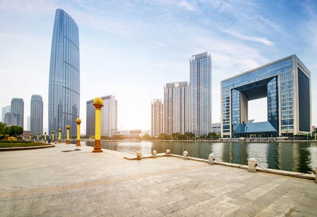 Empty tiled floor and urban skyline, tianjin china