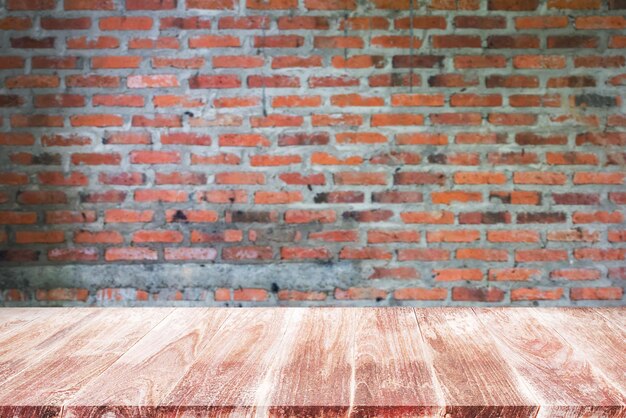 Empty top wooden shelves and stone brick wall background