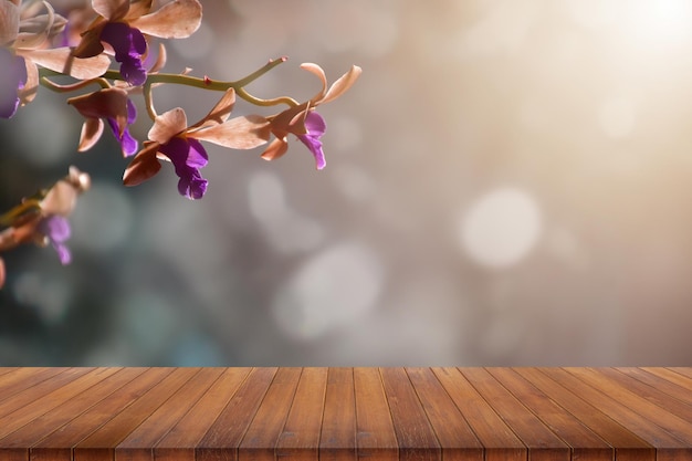 Empty top wooden table on cosmos flowers blur in sunset as background