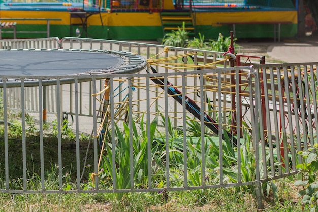 Empty trampoline in a children park