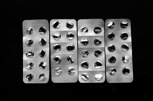 Empty transparent blister packs isolated on black background