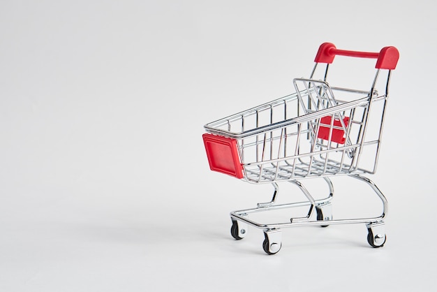 empty trolley on light background shopping supermarket service. High quality photo