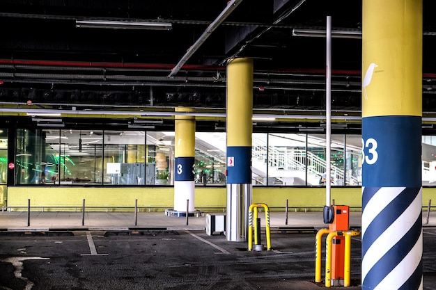 Empty underground Parking of a supermarket. barrier at the entrance to the Parking lot is raised, there are no cars.