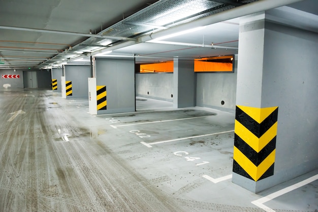 Empty underground parking with lots for cars