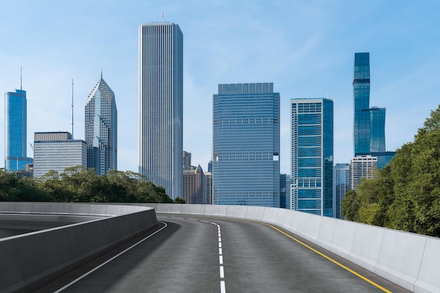 Empty urban asphalt road exterior with city buildings background New modern highway concrete construction Concept of way to success Transportation logistic industry fast delivery Chicago USA