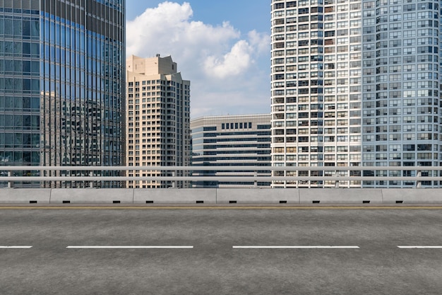 Empty urban asphalt road exterior with city buildings background New modern highway concrete construction Concept of way to success Transportation logistic industry fast delivery Chicago USA