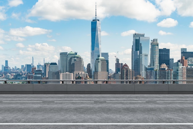 Empty urban asphalt road exterior with city buildings\
background new modern highway concrete construction concept of way\
to success transportation logistic industry fast delivery new york\
usa