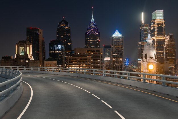 Empty urban asphalt road exterior with city buildings background New modern highway concrete construction Concept way to success Transportation logistic industry fast delivery Philadelphia USA