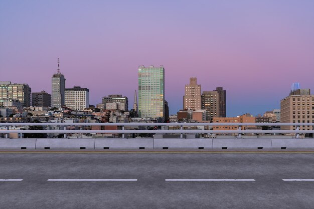 Empty urban asphalt road exterior with city buildings background new modern highway concrete construction concept way to success transportation logistic industry fast delivery san francisco usa