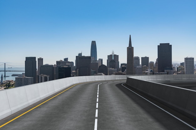 Empty urban asphalt road exterior with city buildings background New modern highway concrete construction Concept way to success Transportation logistic industry fast delivery San Francisco USA