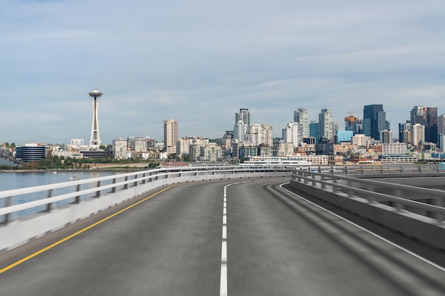 Empty urban asphalt road exterior with city buildings\
background new modern highway concrete construction concept way to\
success transportation logistic industry fast delivery seattle\
usa