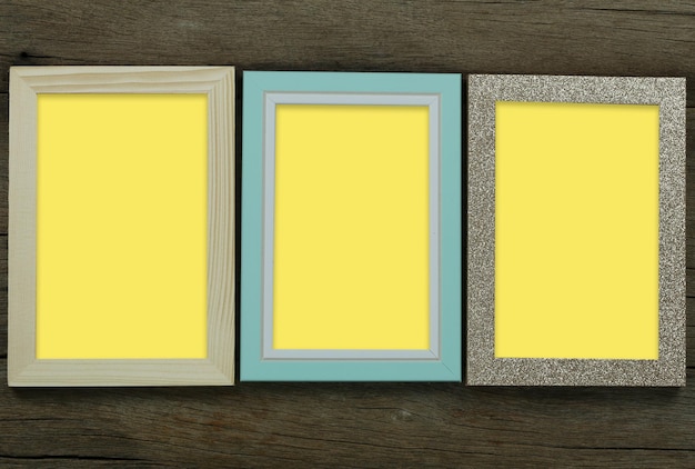 Empty vintage photo frame on old wood background and have copy space for design in your work