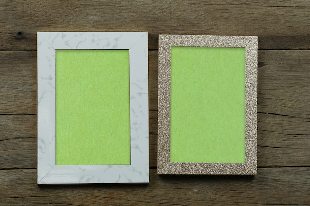 Empty Vintage photo frame on old wood background and have copy space for design in your work.