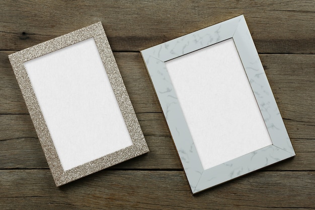 Empty Vintage photo frame on old wood background and have copy space for design in your work.