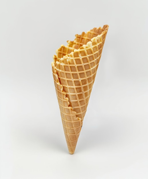 Empty waffle ice cream cone on white background