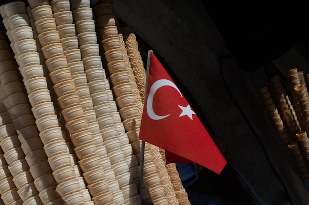 Empty Waffle Ice Cream Cones beside Turkish flag in view