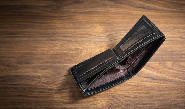 Empty wallet on the wooden table