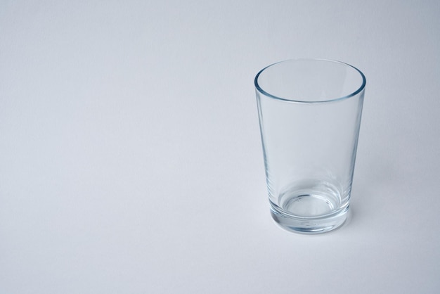 Empty water glass on a white background. Water banner.