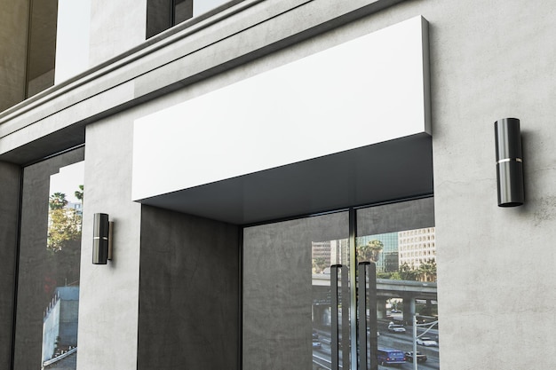 Photo empty white banner over entrance of modern office building