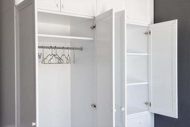 Empty white cabinet with shelves the concept of moving loneliness free space