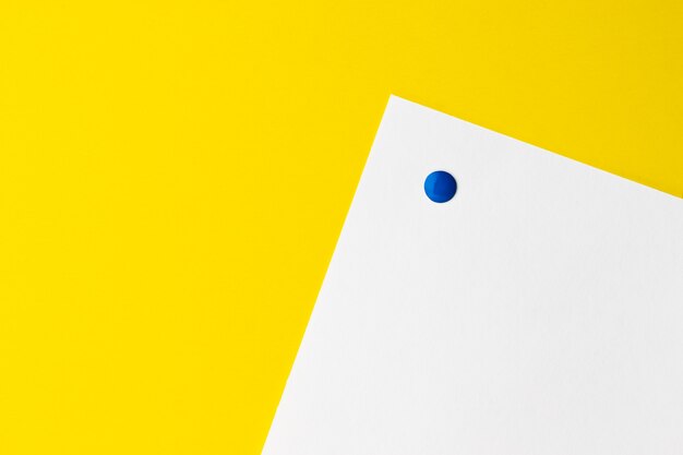 Empty white card is pinned to yellow background