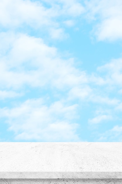 Photo empty white cement table over blue sky nature background